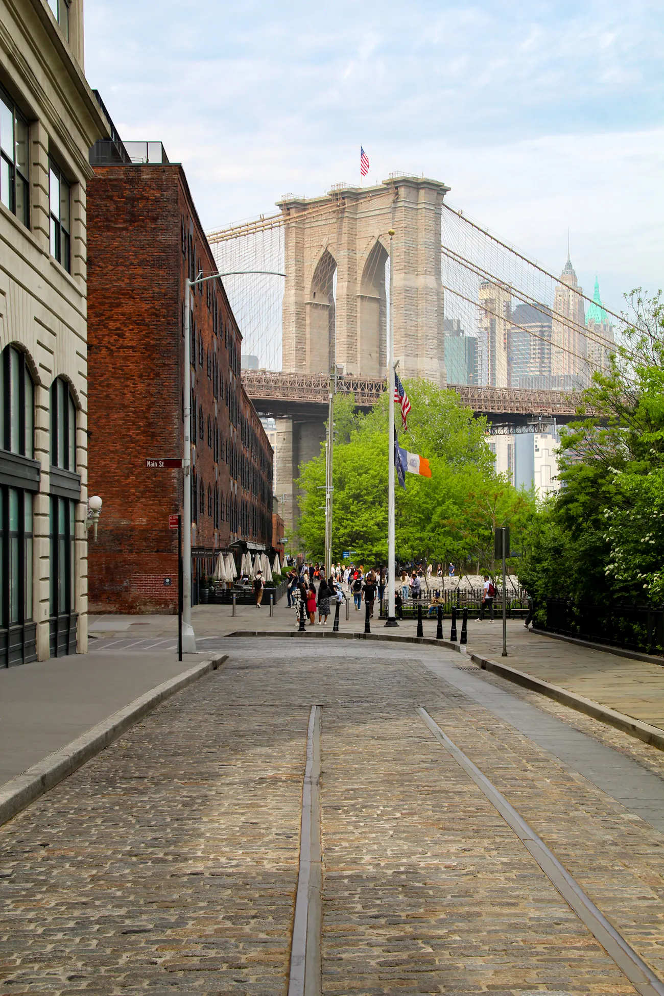 The Brooklyn Bridge seen from a cobblestone street in DUMBO