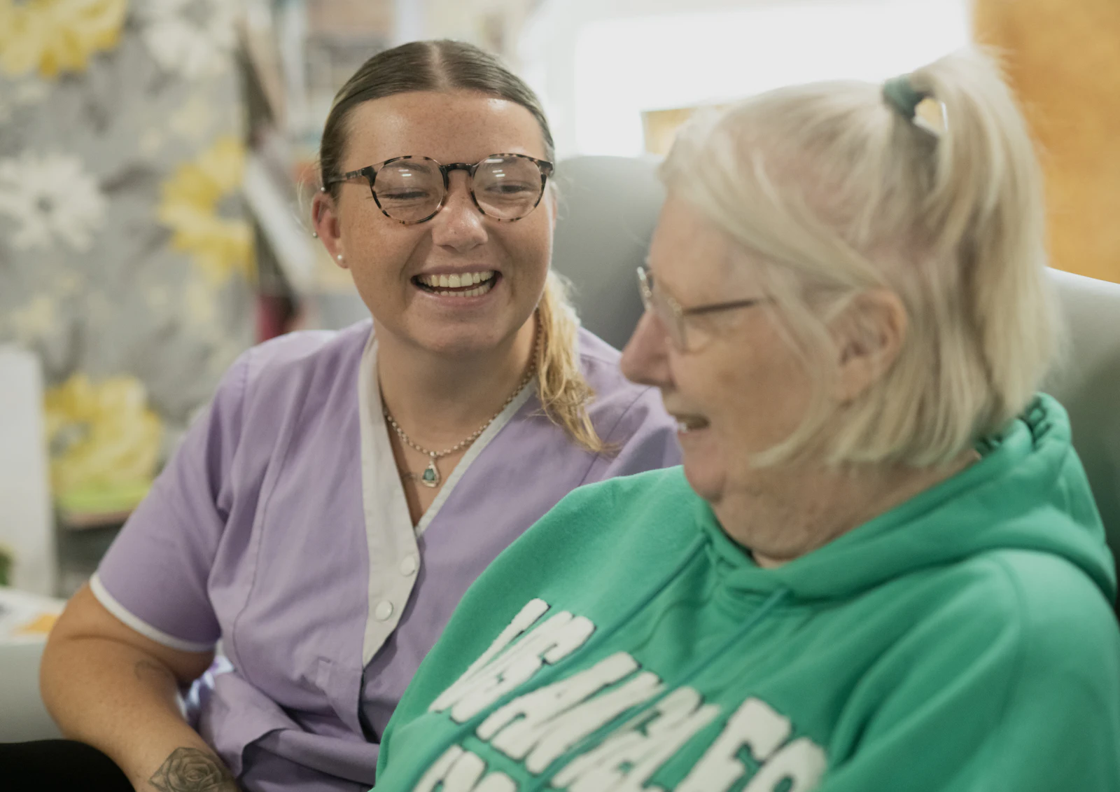 Two women laughing together